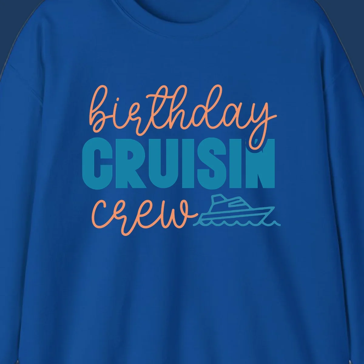 Birthday crushin crew design with coral script text, teal ship illustration, and ocean waves on gray background