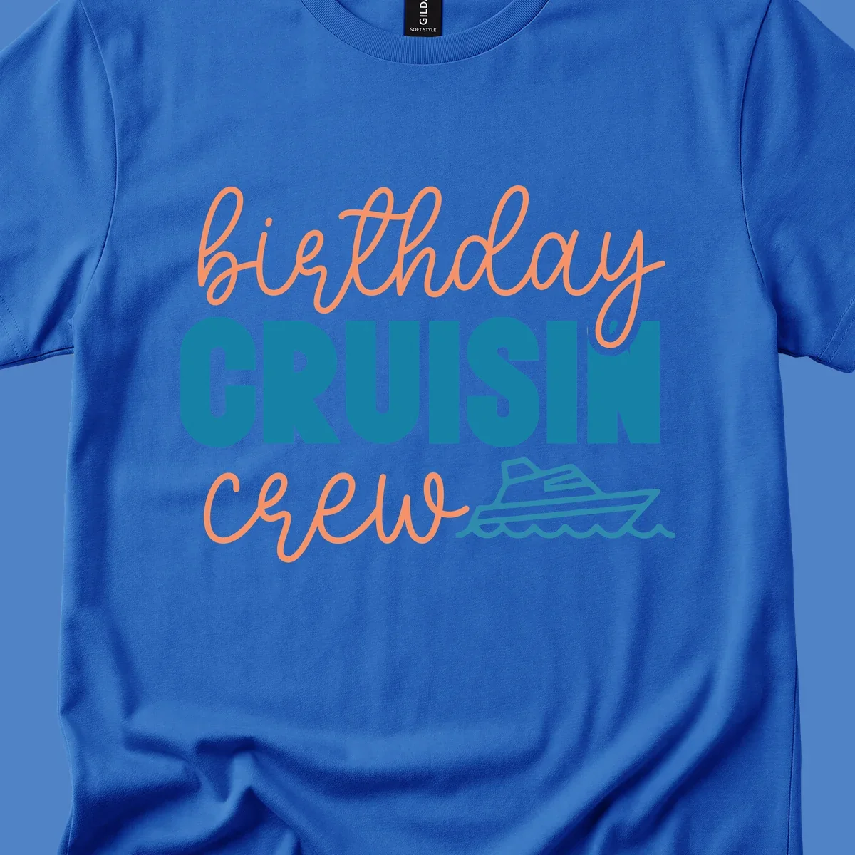Birthday crushin crew design with coral script text, teal ship illustration, and ocean waves on gray background