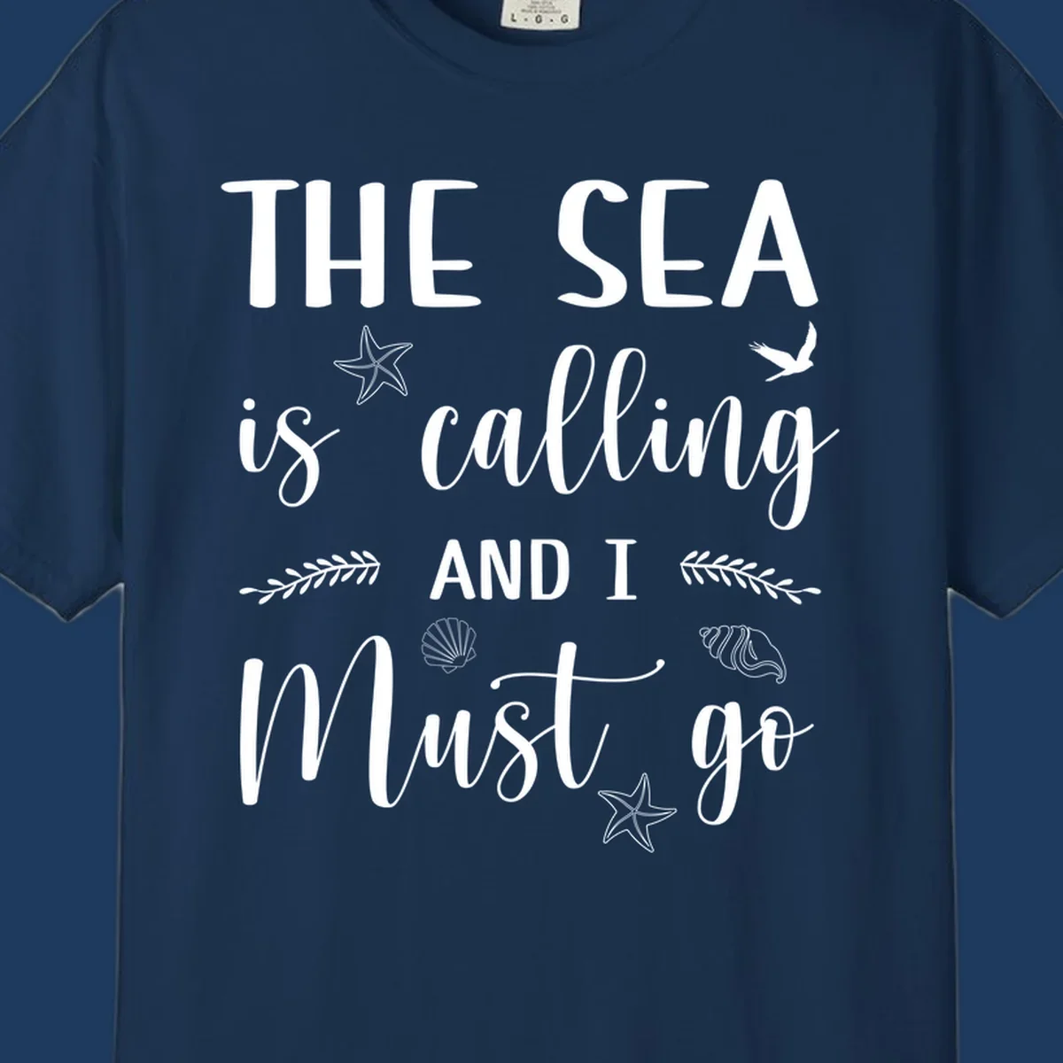 Gray design with white text reading 'The Sea is calling AND I MUST go' surrounded by starfish, seashells, a flying bird, and leaf accents