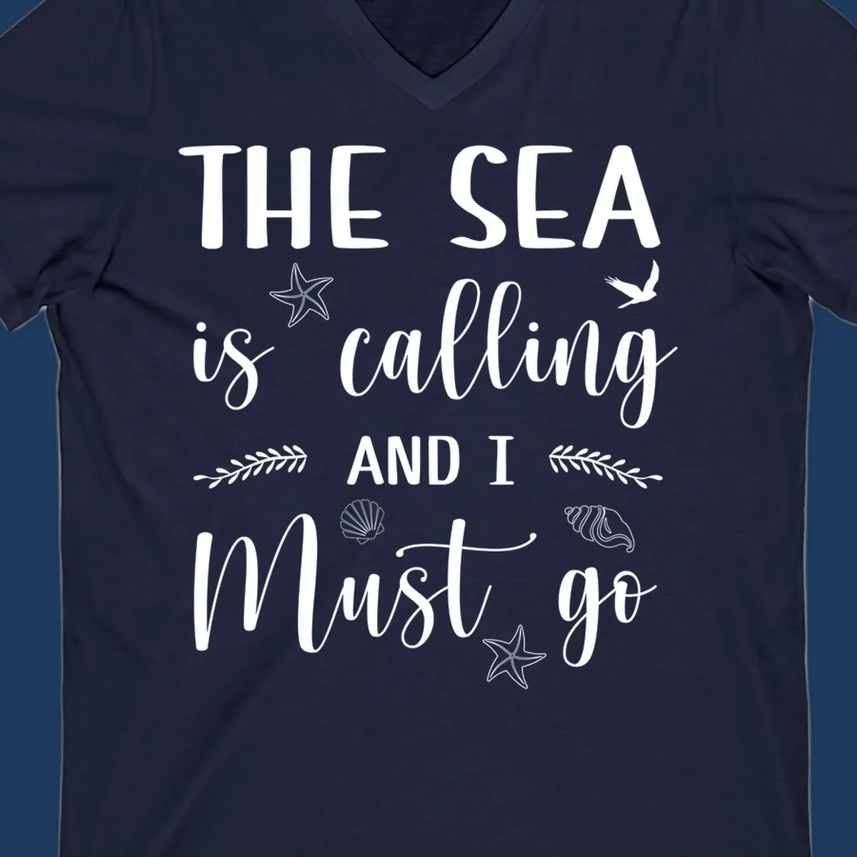 Gray design with white text reading 'The Sea is calling AND I MUST go' surrounded by starfish, seashells, a flying bird, and leaf accents