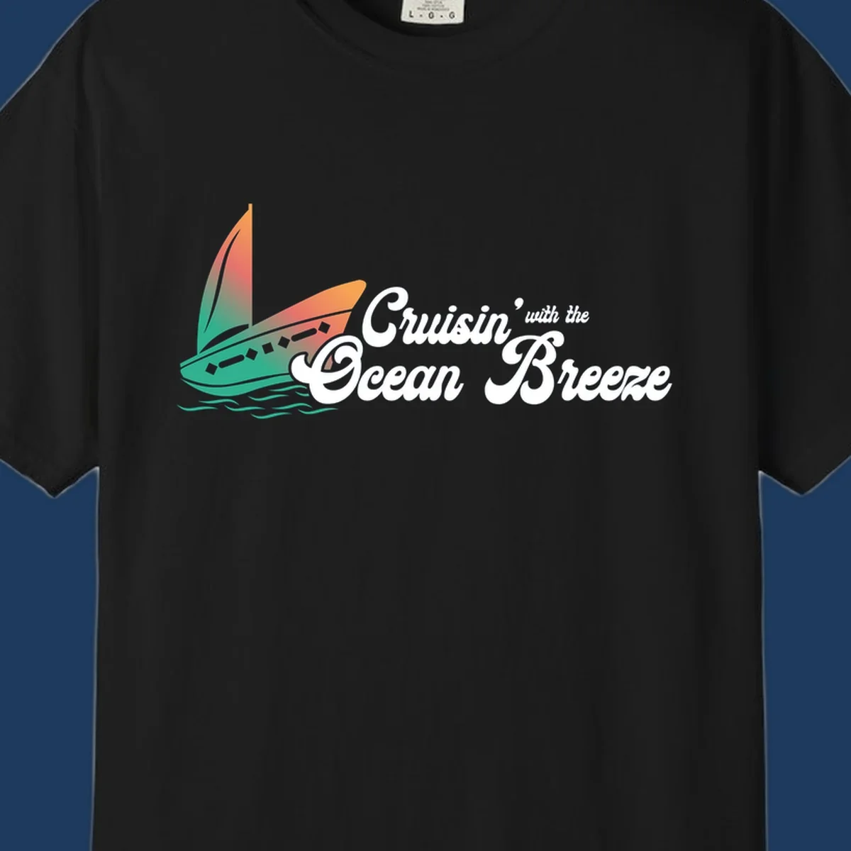 Sailboat with gradient orange-to-green sail on ocean waves with 'Cruisin' with the Ocean Breeze' text in white script