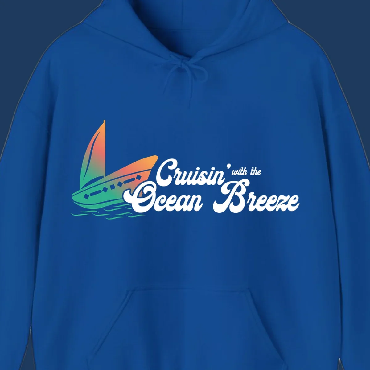 Sailboat with gradient orange-to-green sail on ocean waves with 'Cruisin' with the Ocean Breeze' text in white script