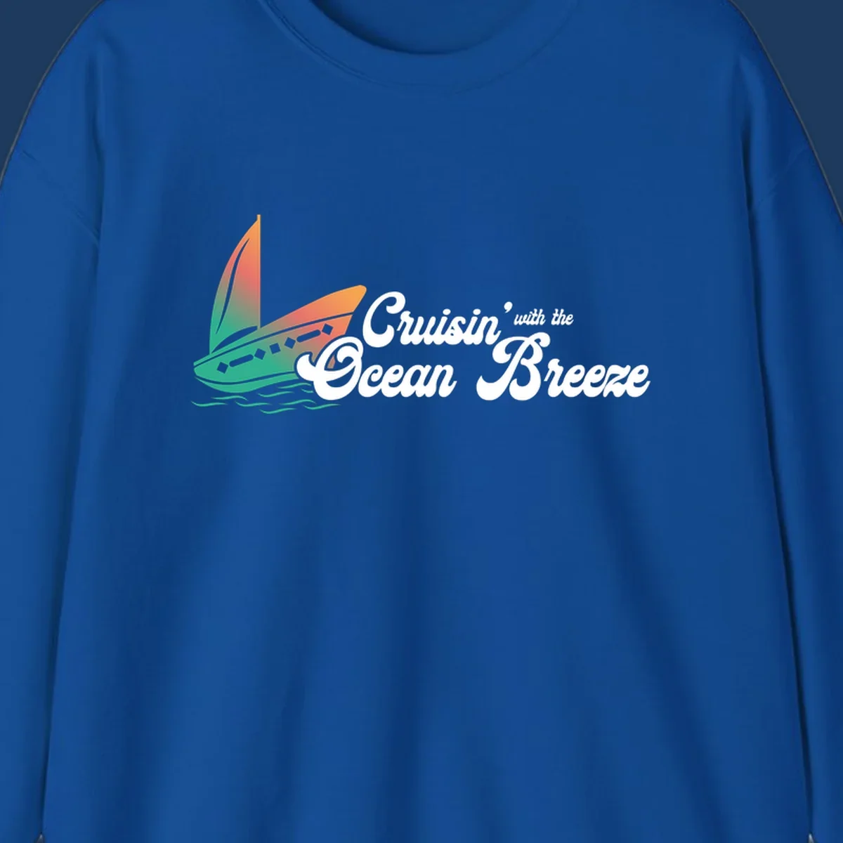 Sailboat with gradient orange-to-green sail on ocean waves with 'Cruisin' with the Ocean Breeze' text in white script