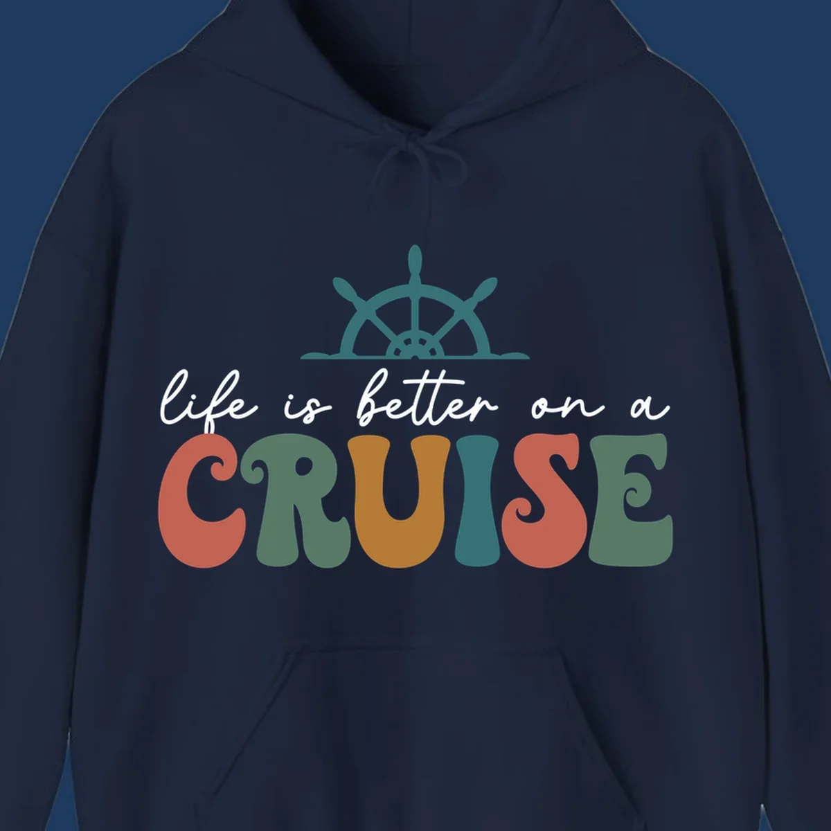 Life is better on a cruise design with ship's wheel and colorful text on gray background