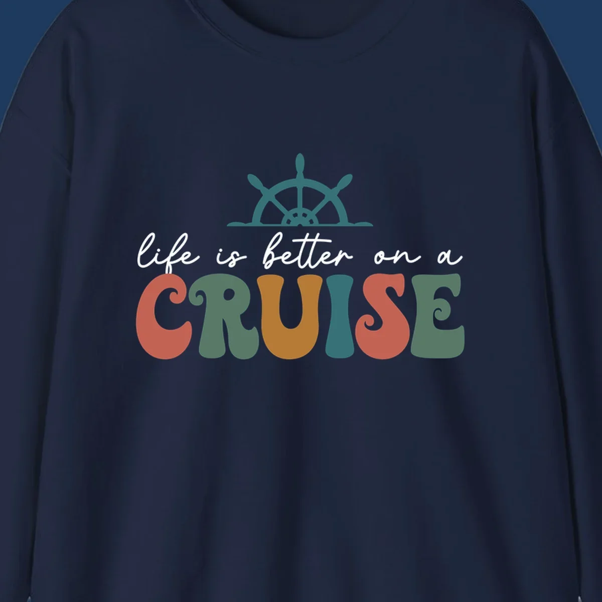 Life is better on a cruise design with ship's wheel and colorful text on gray background