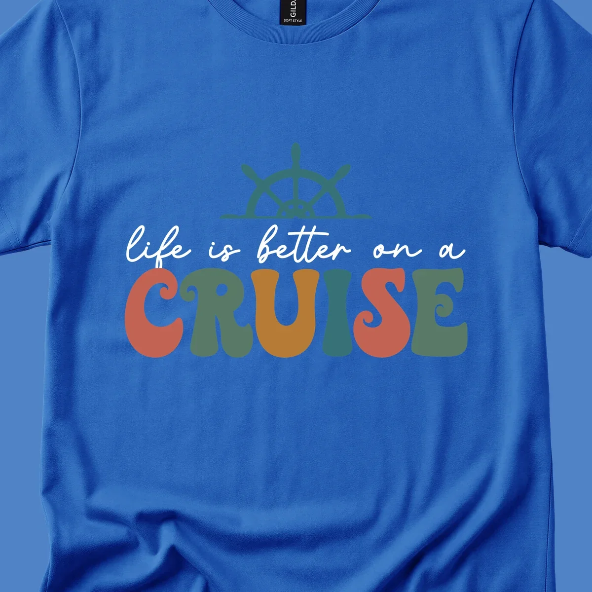 Life is better on a cruise design with ship's wheel and colorful text on gray background
