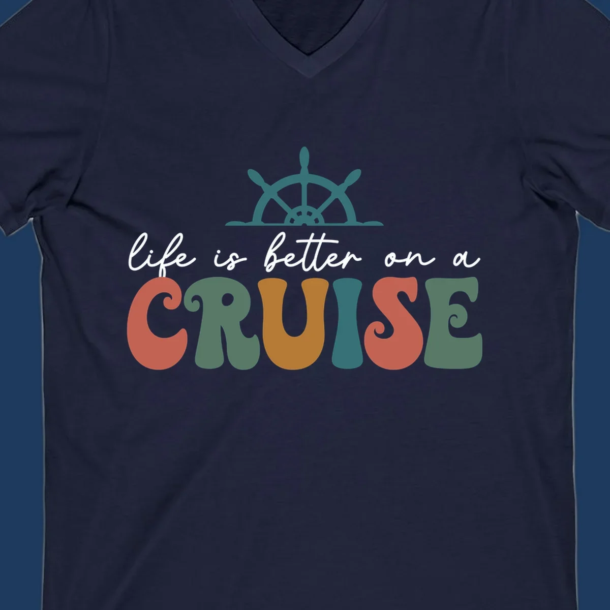 Life is better on a cruise design with ship's wheel and colorful text on gray background