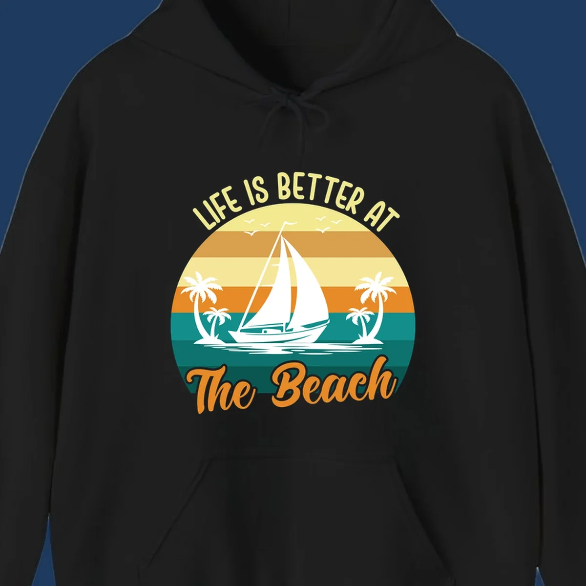 Vintage retro sunset design with sailboat, palm trees, and 'Life Is Better At The Beach' text in warm and teal tones