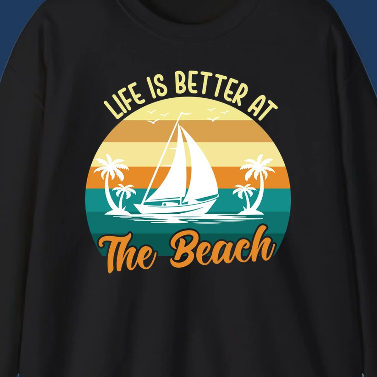 Vintage retro sunset design with sailboat, palm trees, and 'Life Is Better At The Beach' text in warm and teal tones