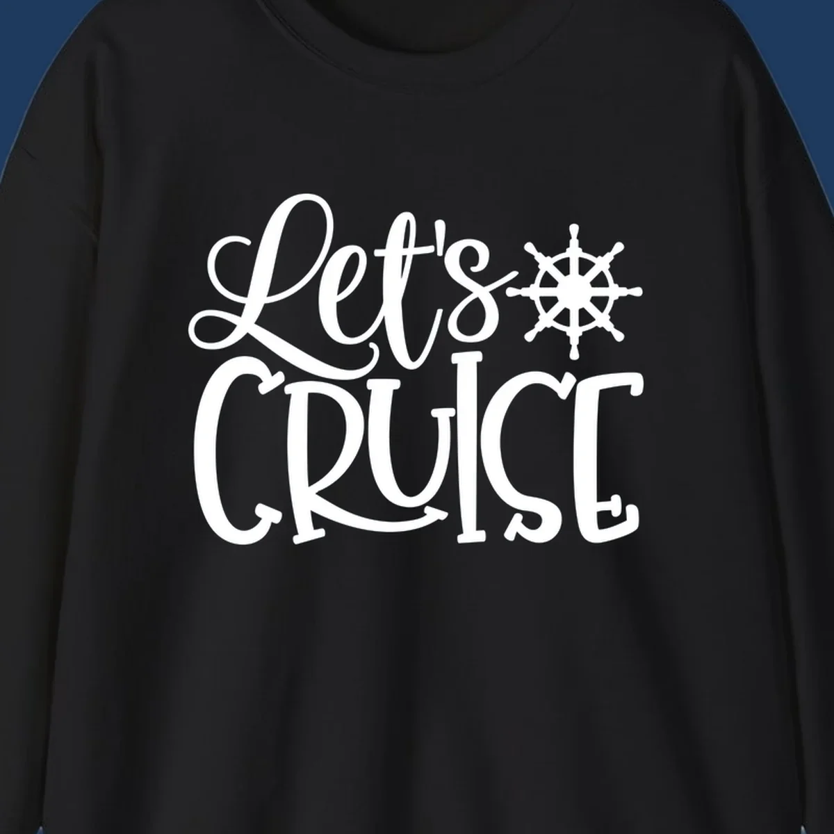 Let's Cruise design with flowing script lettering and nautical ship's wheel graphic in white