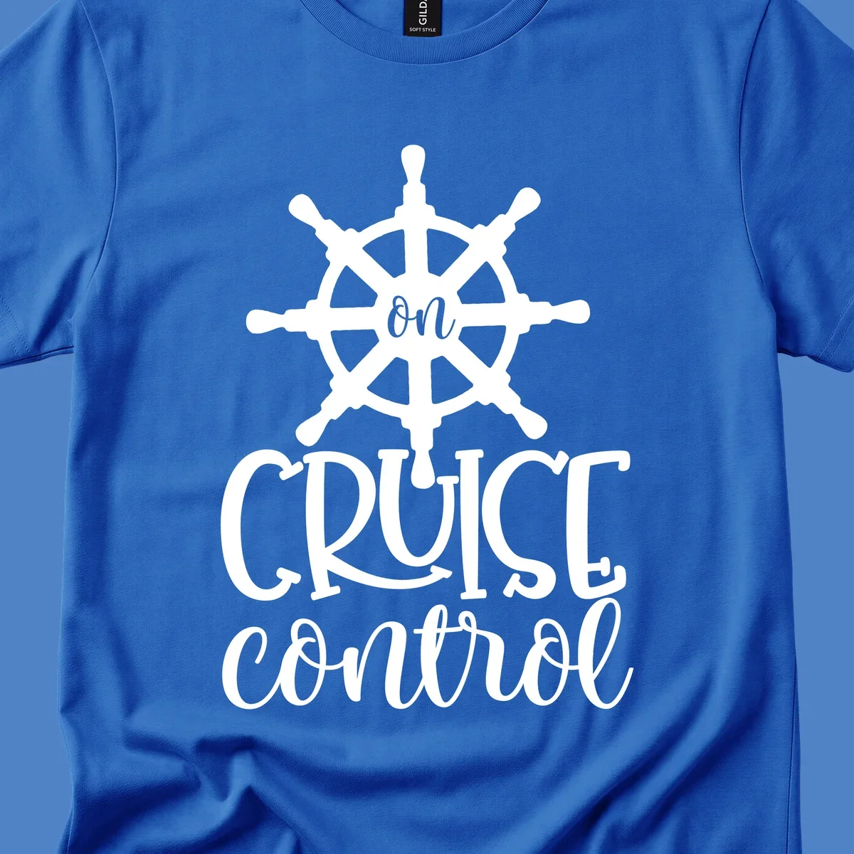 White ship wheel with 'ON CRUISE CONTROL' text below on gray background - nautical cruise design