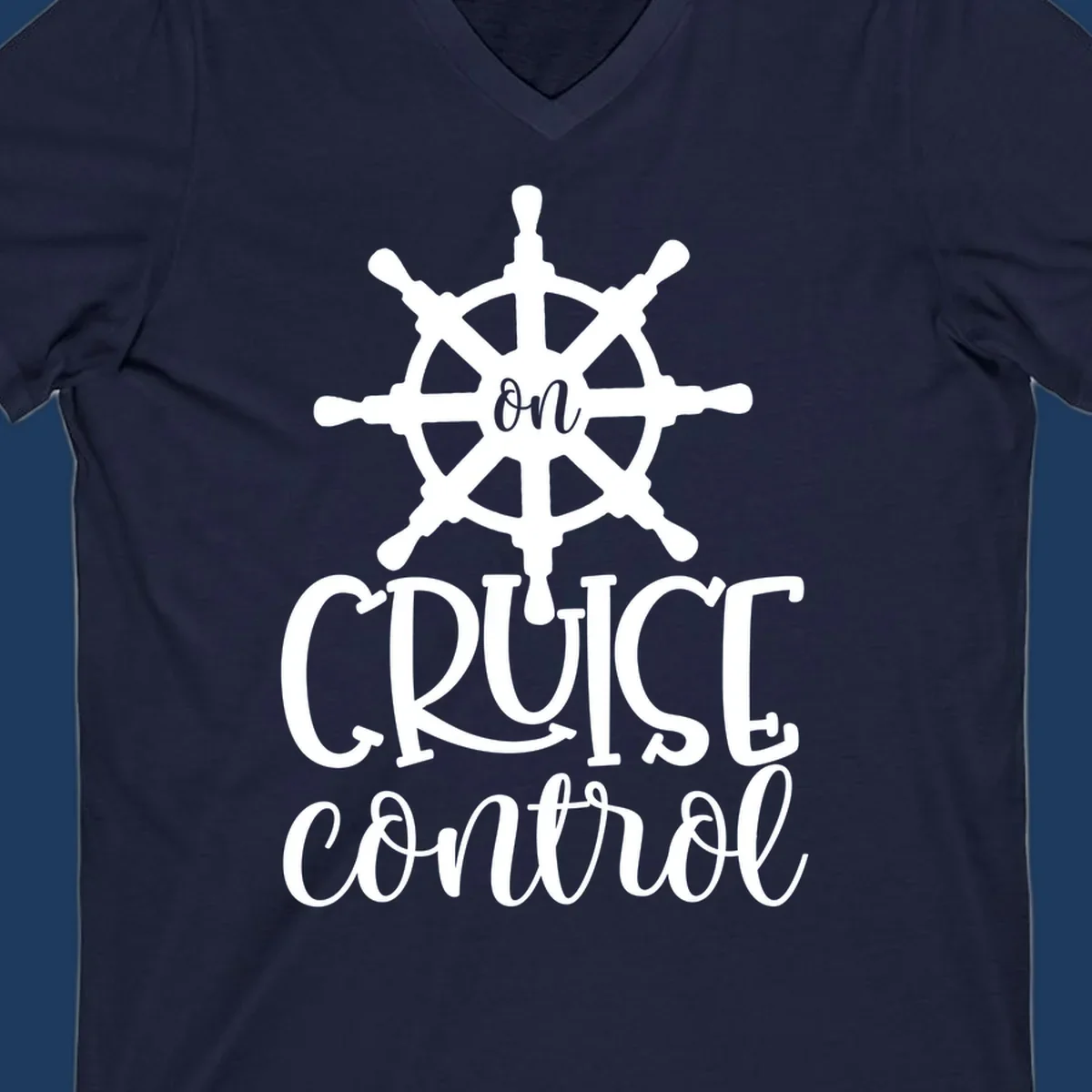 White ship wheel with 'ON CRUISE CONTROL' text below on gray background - nautical cruise design