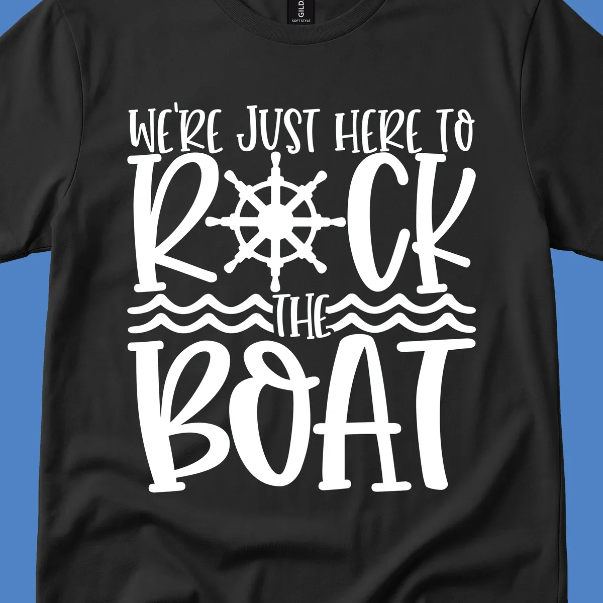 White nautical design with ship's wheel and ocean waves featuring text 'We're Just Here To Kick The Boat' on gray background