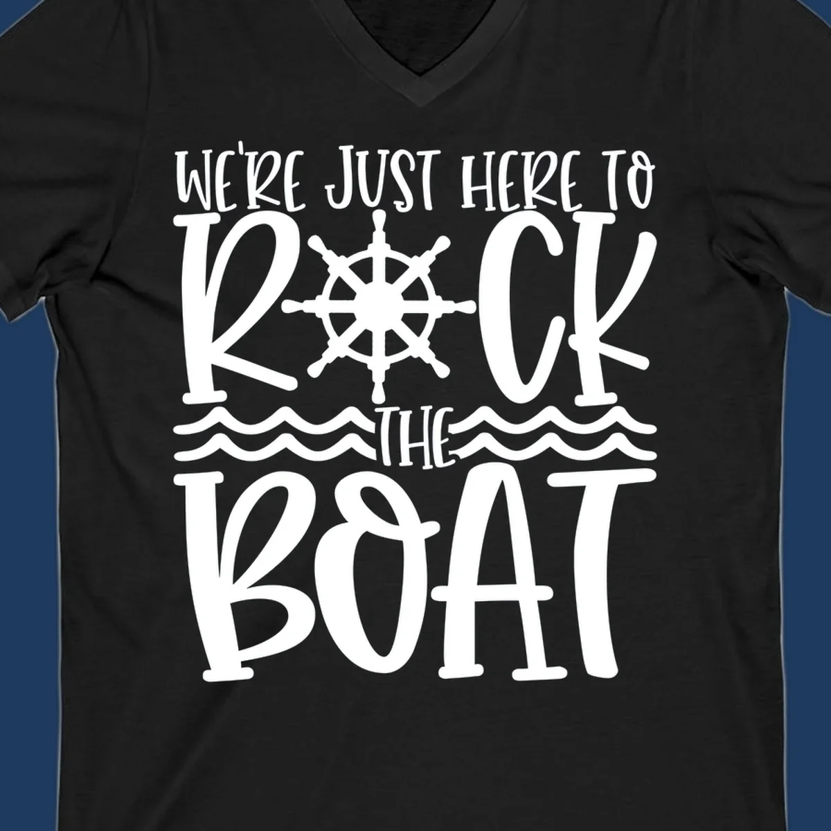 White nautical design with ship's wheel and ocean waves featuring text 'We're Just Here To Kick The Boat' on gray background