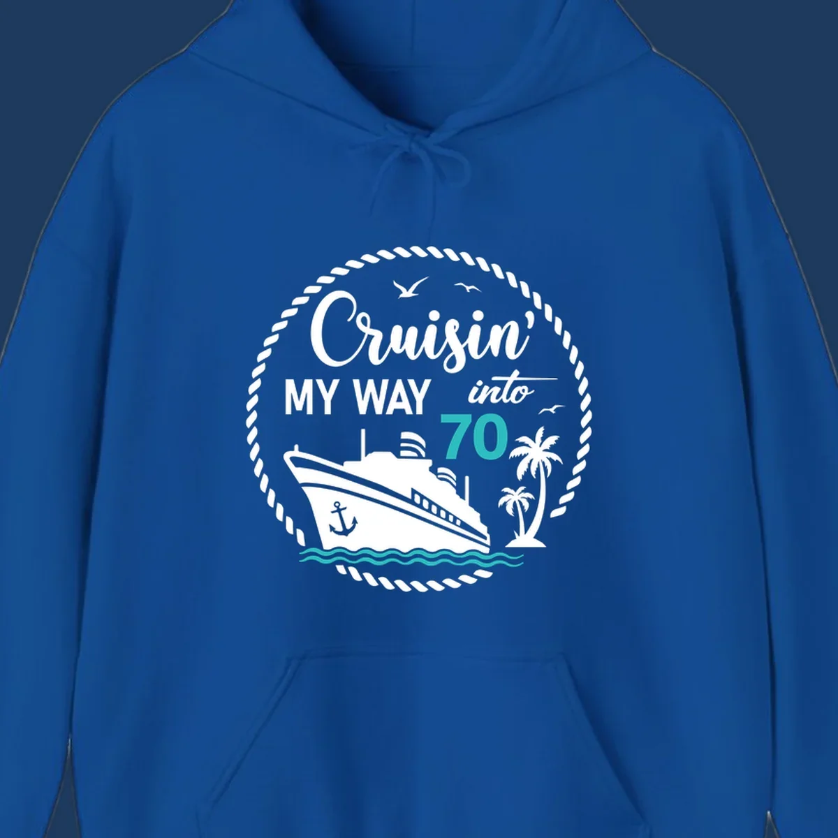 Nautical 70th birthday design with cruise ship, palm trees, and waves. Text reads 'Cruisin' MY WAY into 70' in white and teal on gray background.