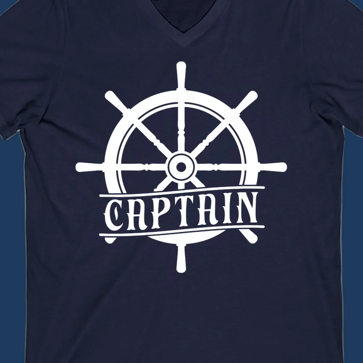 White captain ship wheel design with eight spokes and center hub, featuring the word CAPTAIN below in bold lettering with decorative lines on gray background.