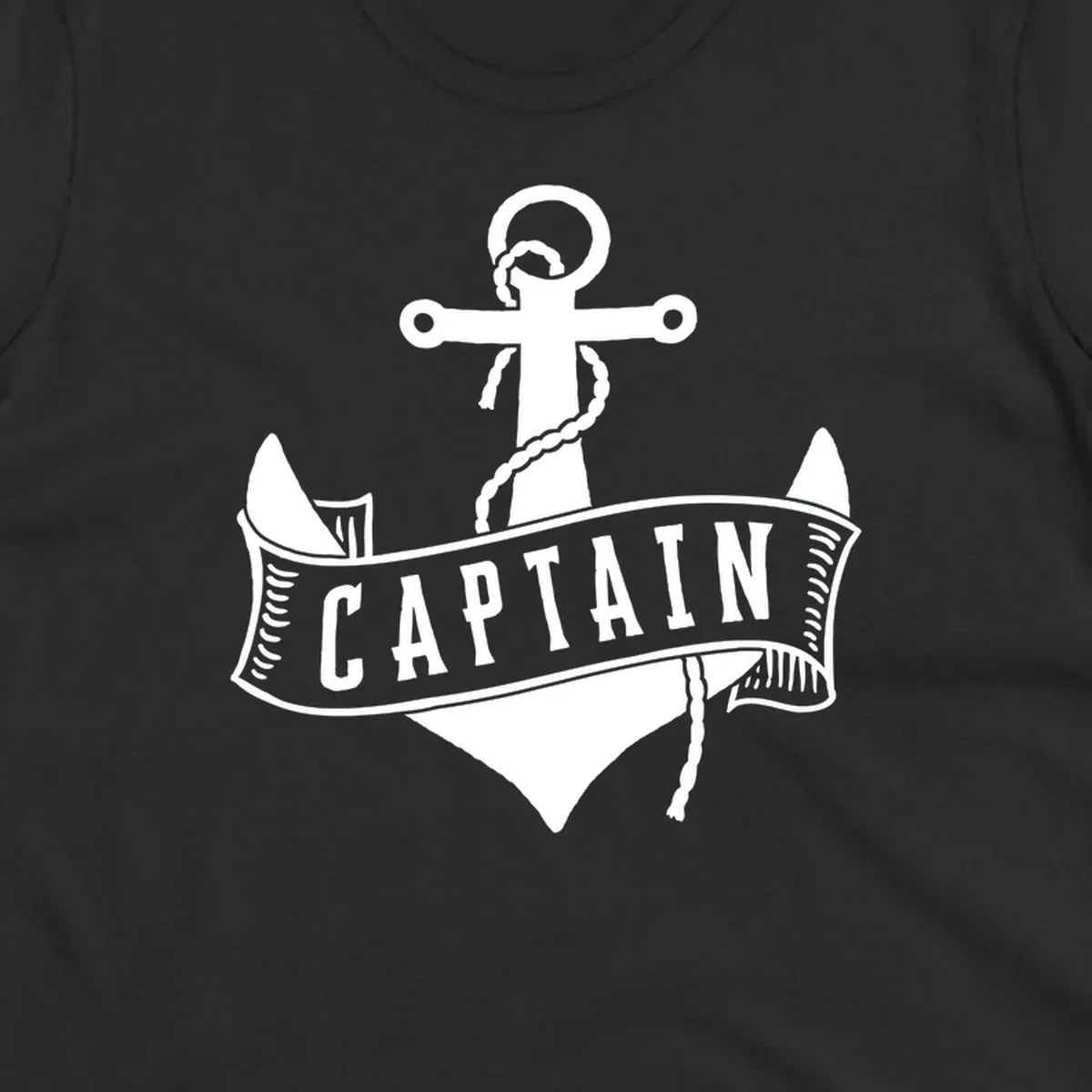 Vintage nautical captain anchor badge design with rope, cross emblem, sailing ship, and banner ribbon on gray background.
