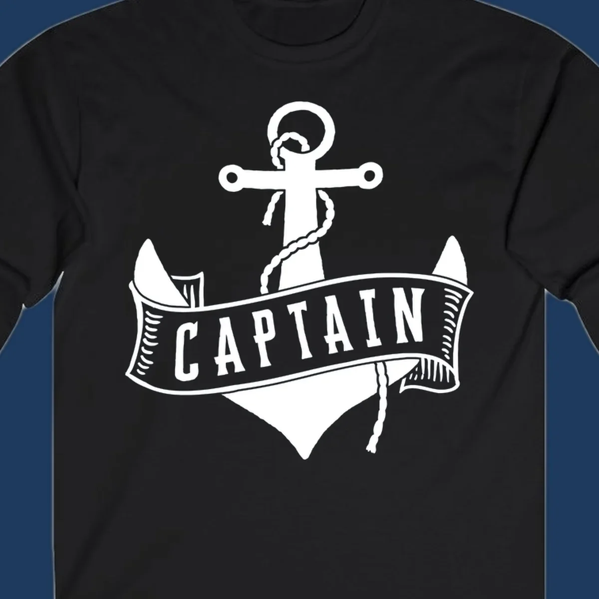 Vintage nautical captain anchor badge design with rope, cross emblem, sailing ship, and banner ribbon on gray background.
