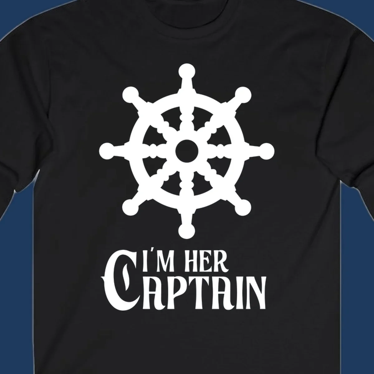 White ship's wheel with gray center above 'I'm Her Captain' text for cruise vacation apparel
