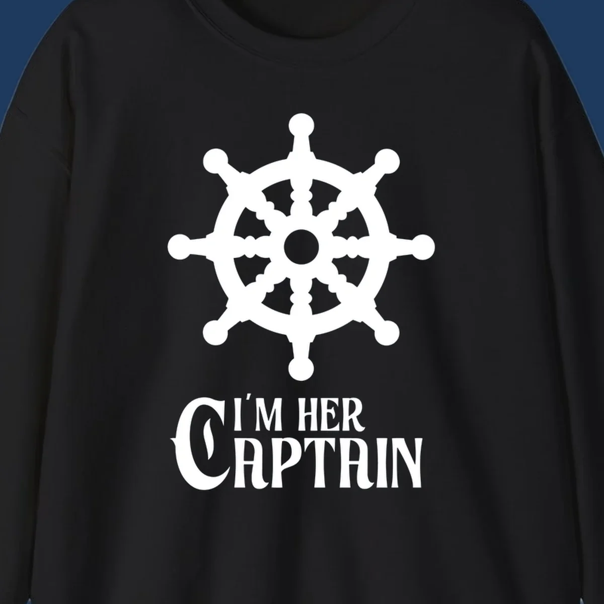 White ship's wheel with gray center above 'I'm Her Captain' text for cruise vacation apparel