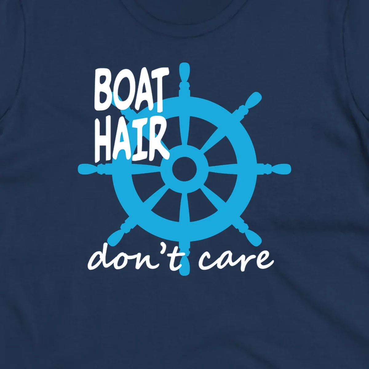 Blue ship's wheel graphic with white text reading 'BOAT HAIR don't care' - nautical cruise humor design