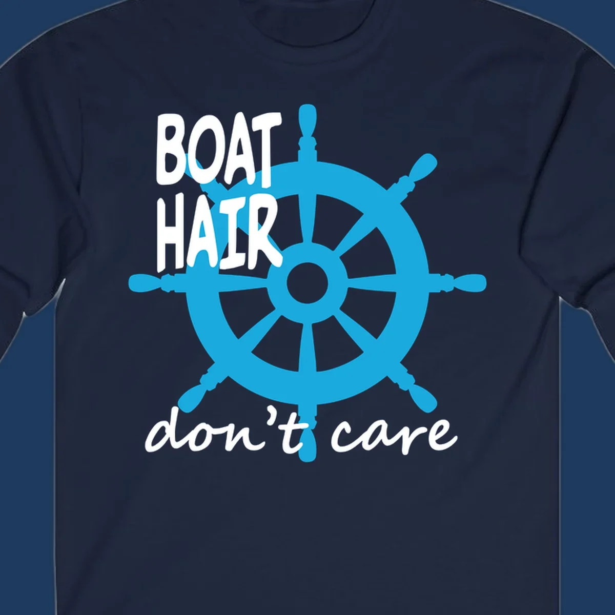Blue ship's wheel graphic with white text reading 'BOAT HAIR don't care' - nautical cruise humor design