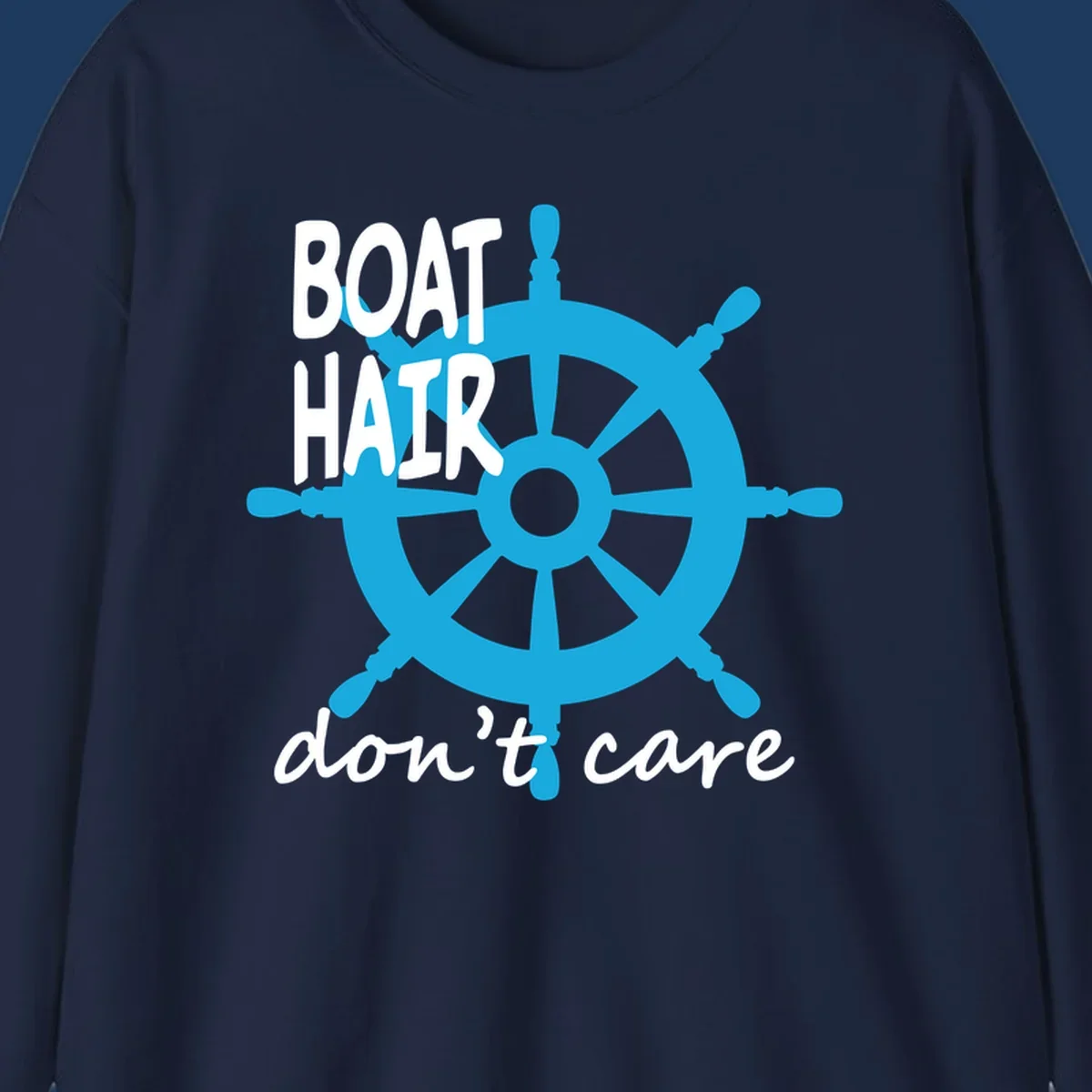 Blue ship's wheel graphic with white text reading 'BOAT HAIR don't care' - nautical cruise humor design
