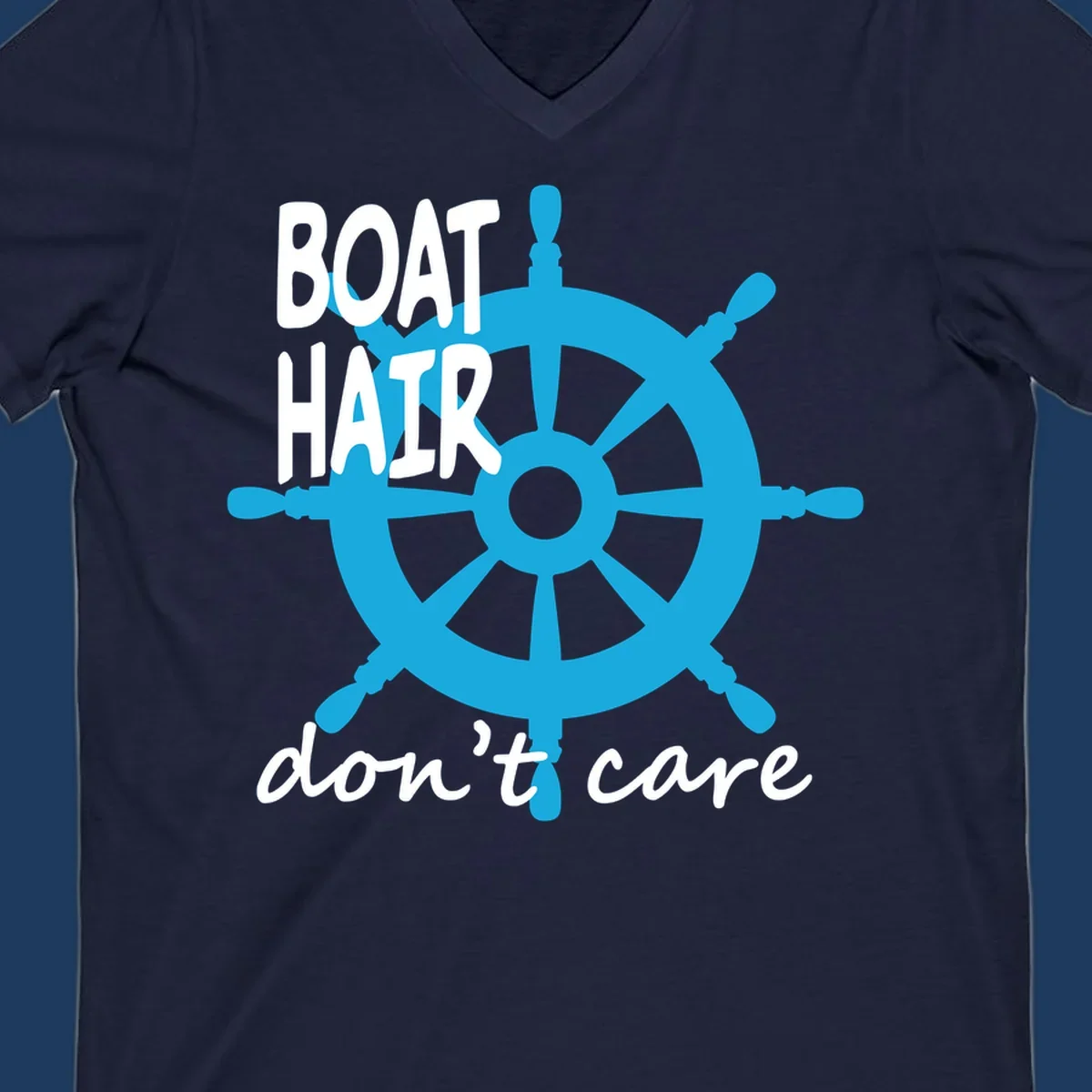 Blue ship's wheel graphic with white text reading 'BOAT HAIR don't care' - nautical cruise humor design