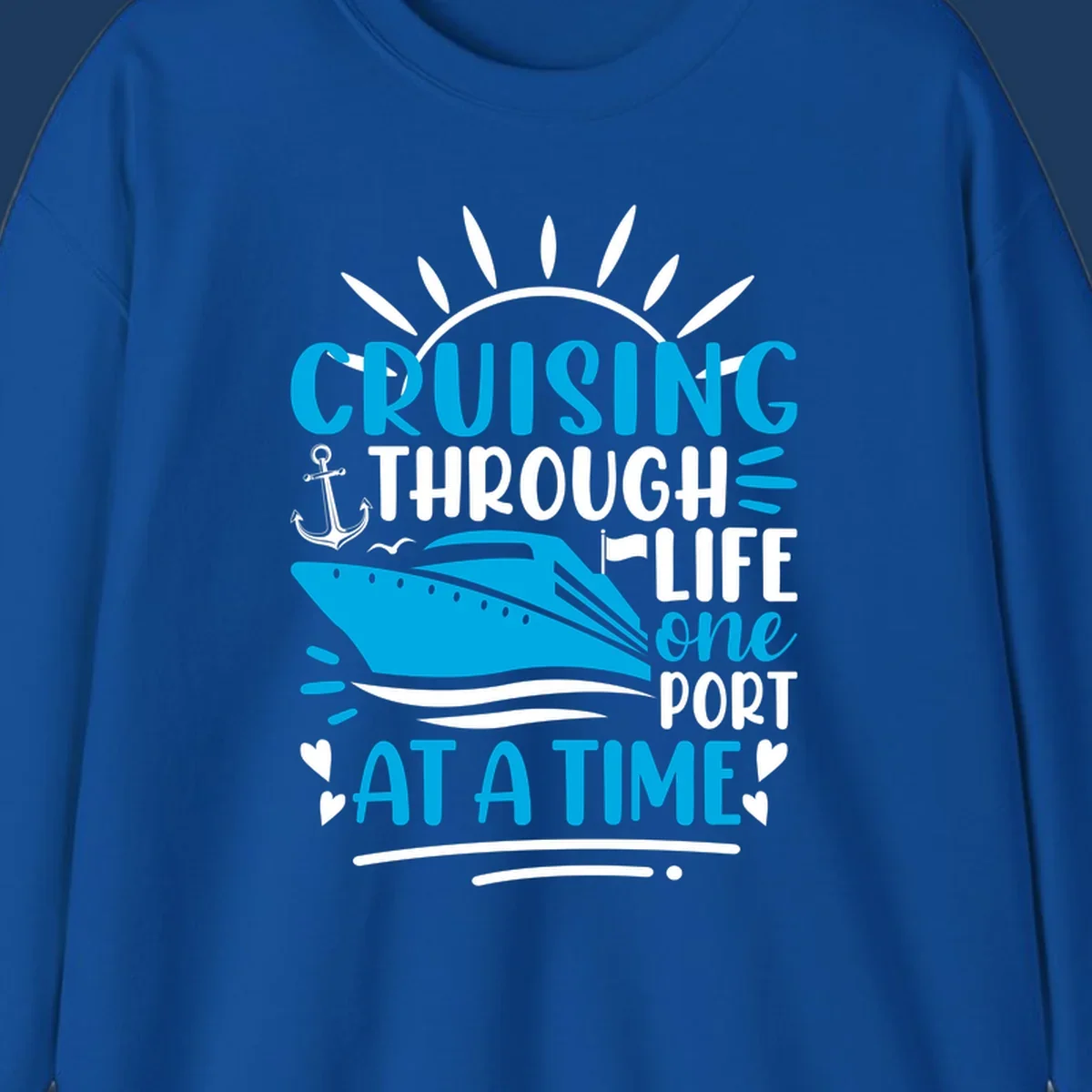 Blue cruise ship with sun rays and ocean waves, text reading 'Cruising Through Life One Port At A Time' with nautical anchor and heart decorations