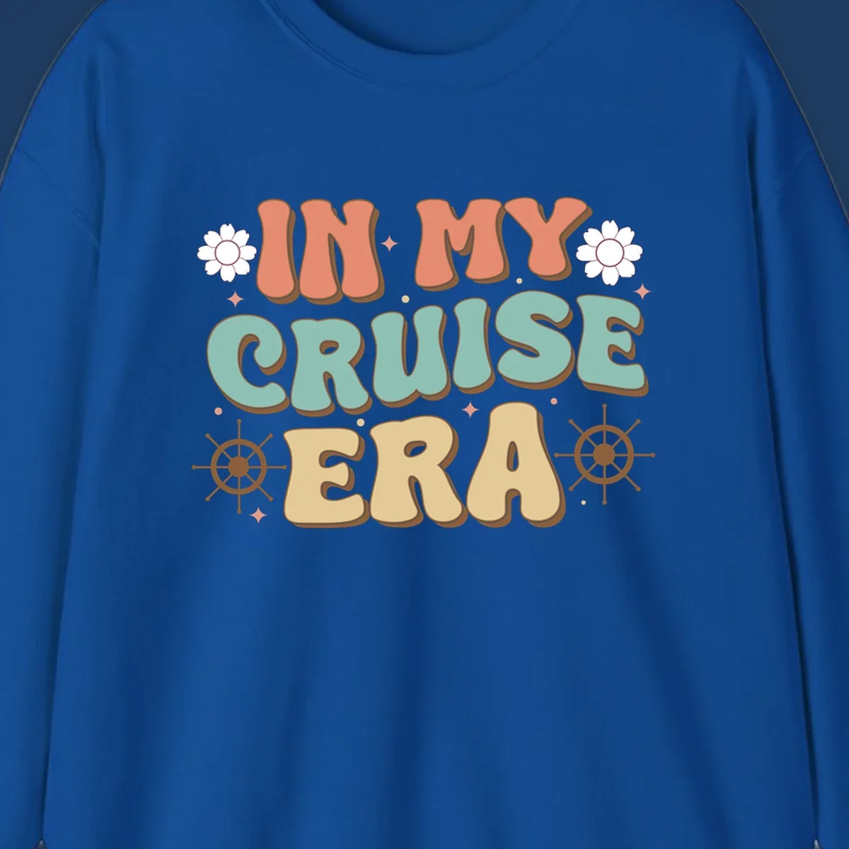 Retro-style design reading 'In My Cruise Era' with nautical ship wheels, daisies, and sparkles on gray background