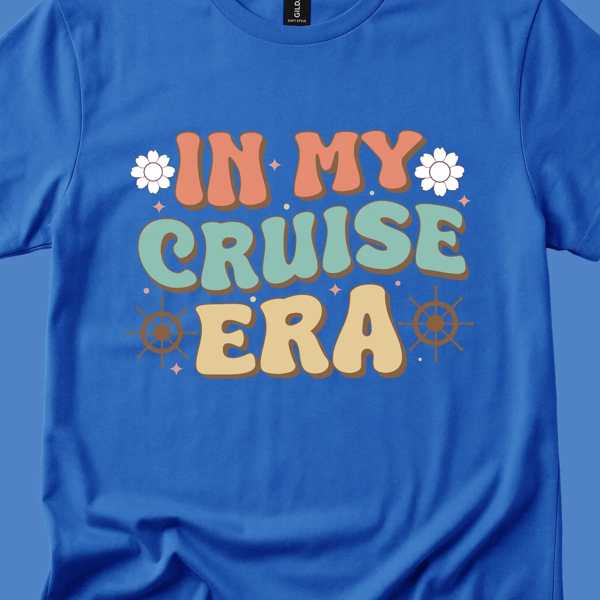 Retro-style design reading 'In My Cruise Era' with nautical ship wheels, daisies, and sparkles on gray background