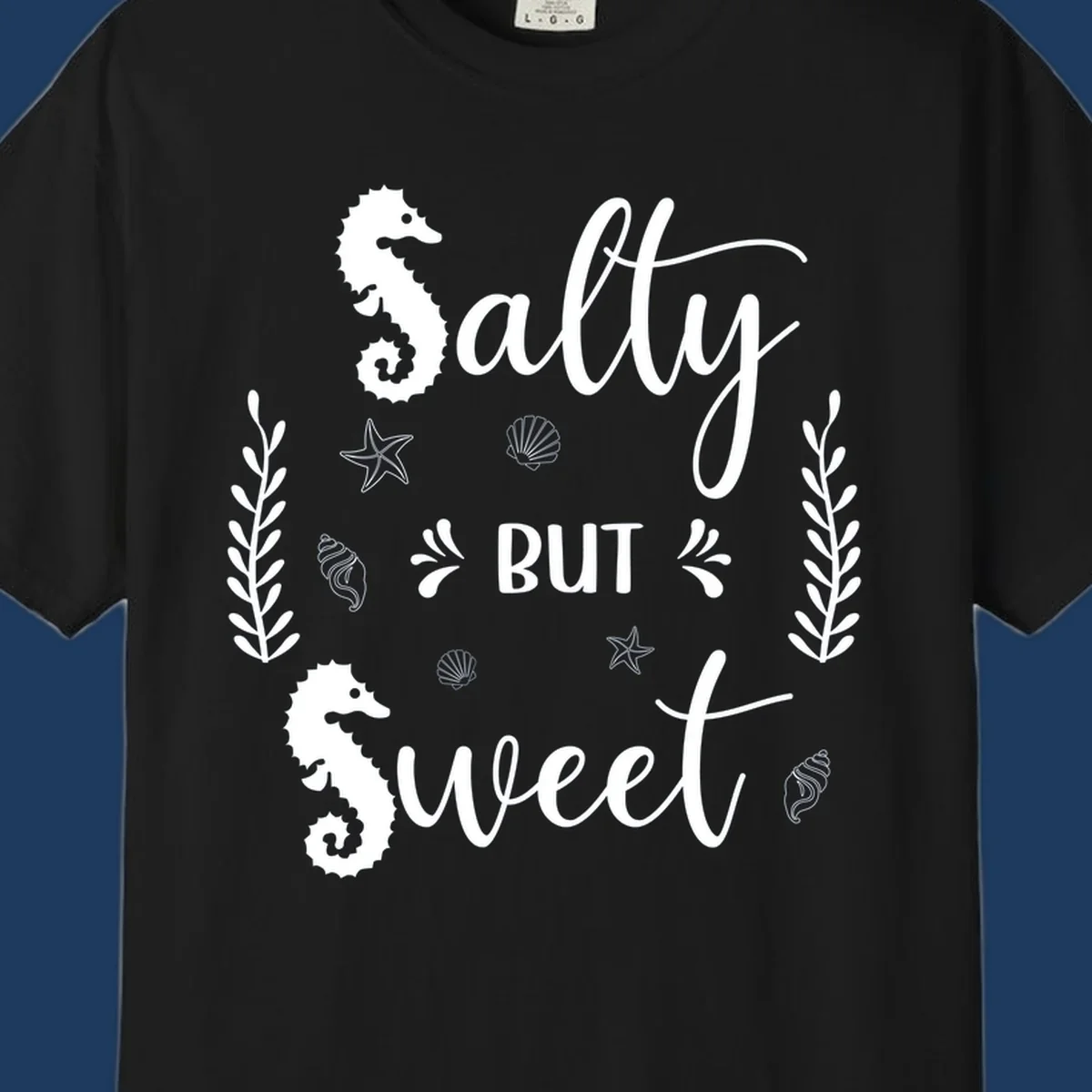 Salty but sweet nautical design with seahorses, starfish, and seashells in white on gray background