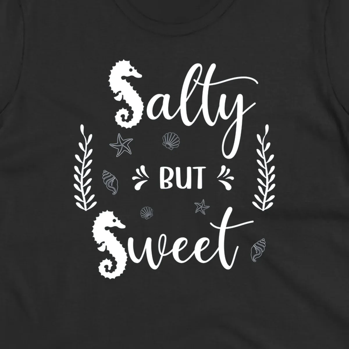 Salty but sweet nautical design with seahorses, starfish, and seashells in white on gray background