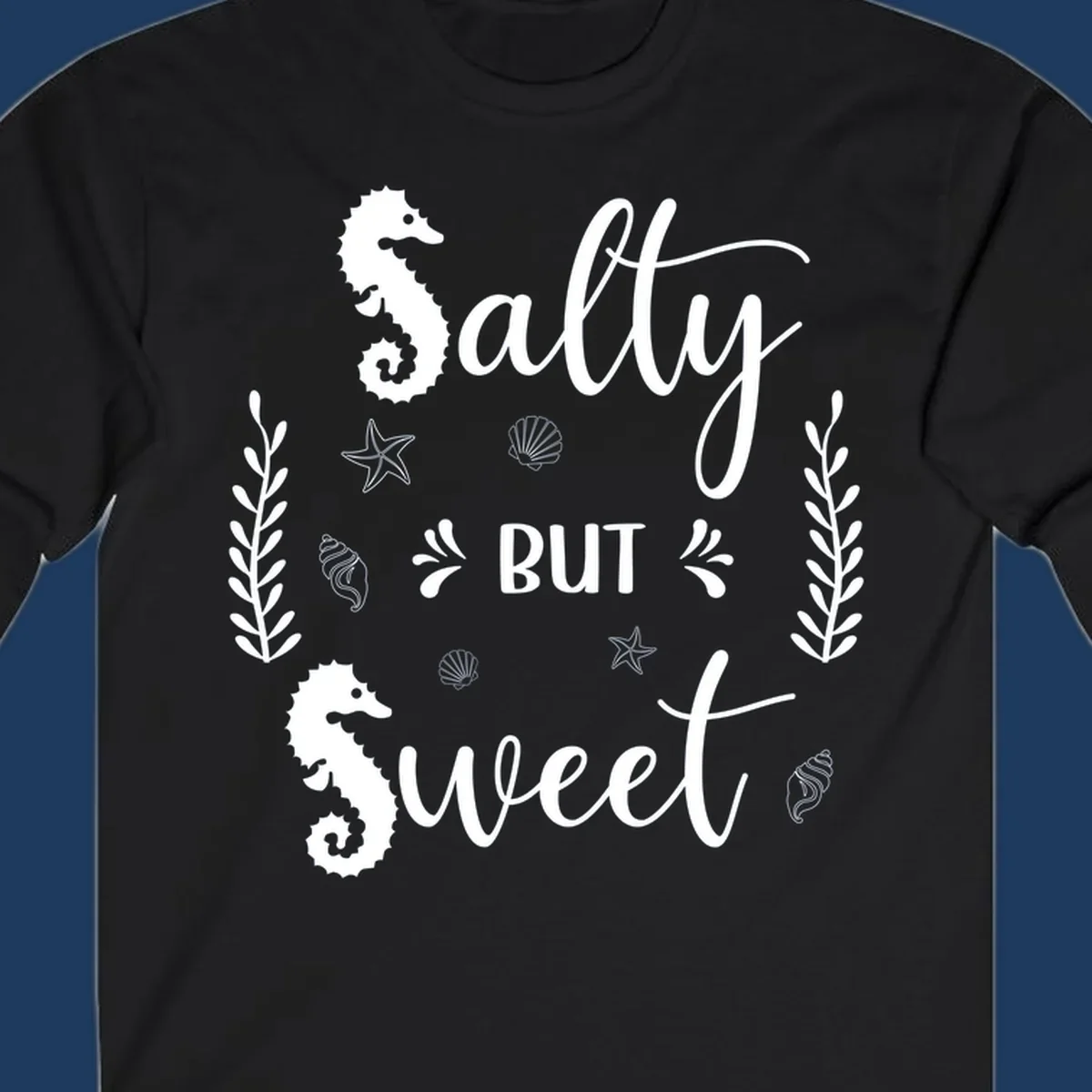 Salty but sweet nautical design with seahorses, starfish, and seashells in white on gray background
