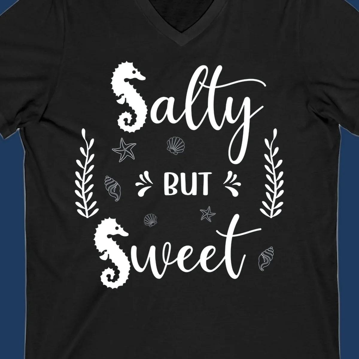 Salty but sweet nautical design with seahorses, starfish, and seashells in white on gray background