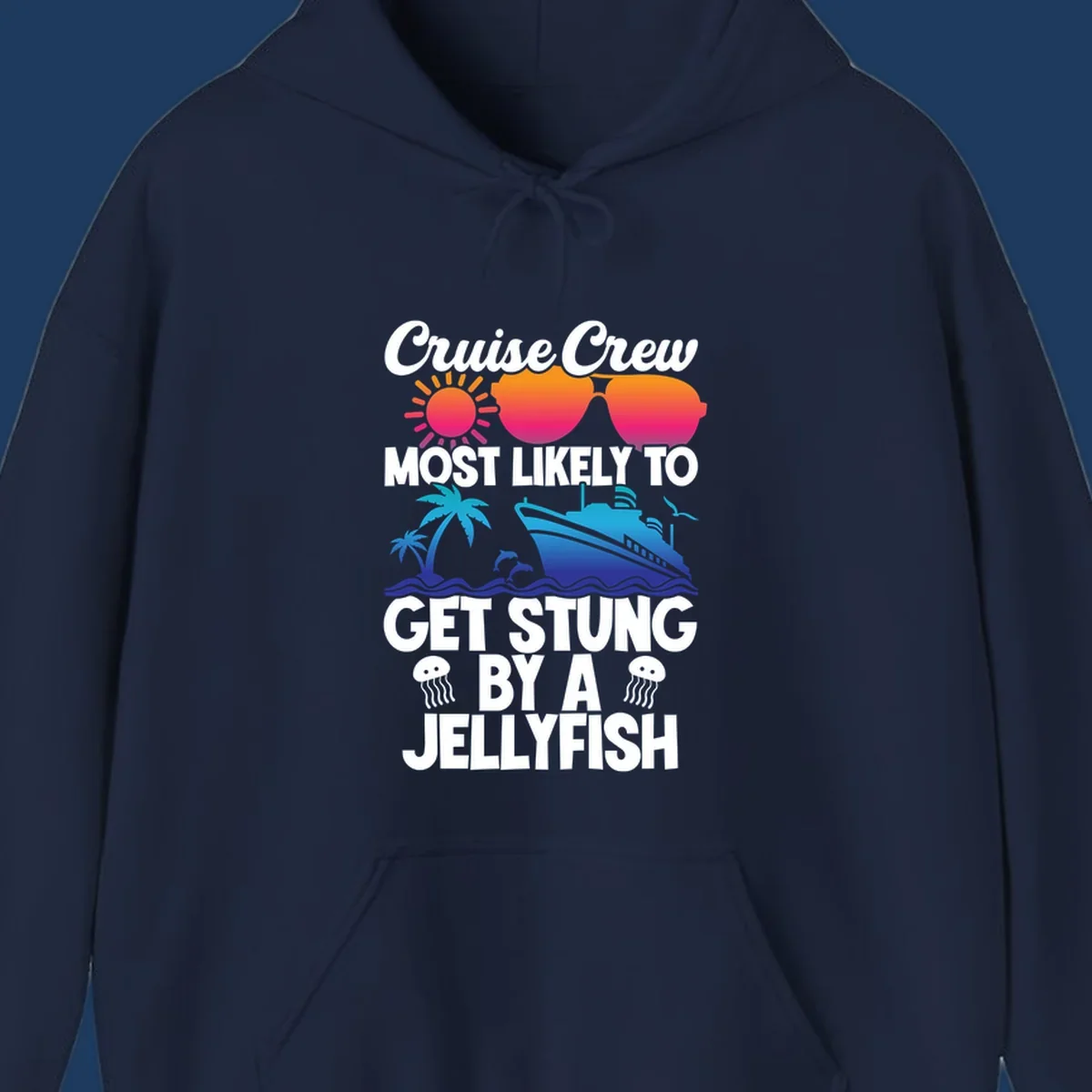 Colorful cruise design with sun, ship, dolphins, and jellyfish. Text reads 'Cruise Crew Most Likely To Get Stung By A Jellyfish'