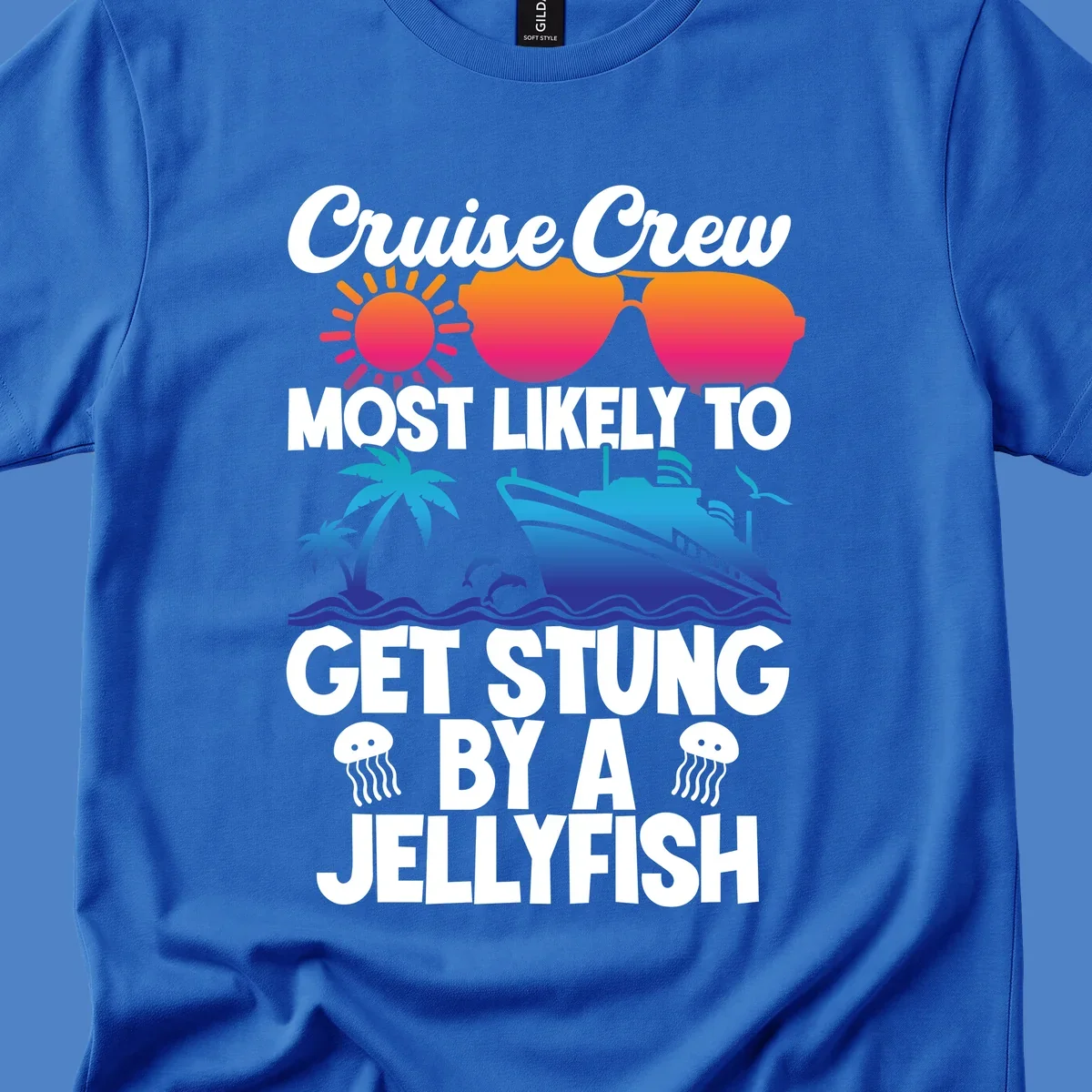 Colorful cruise design with sun, ship, dolphins, and jellyfish. Text reads 'Cruise Crew Most Likely To Get Stung By A Jellyfish'