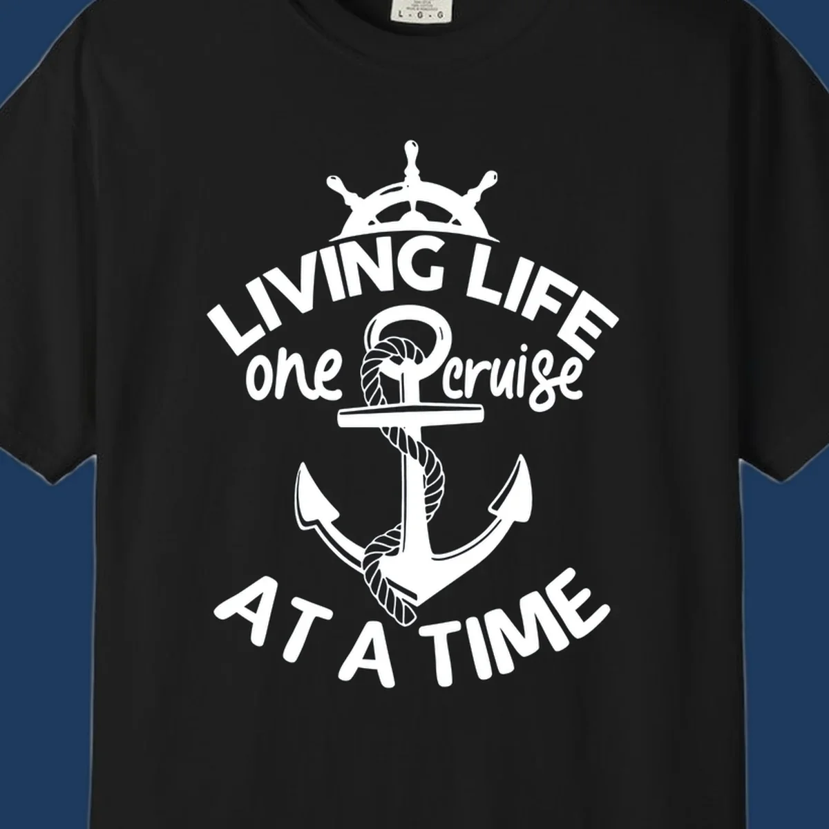 White nautical design with ship's wheel, anchor and rope on gray background with text living life one cruise at a time