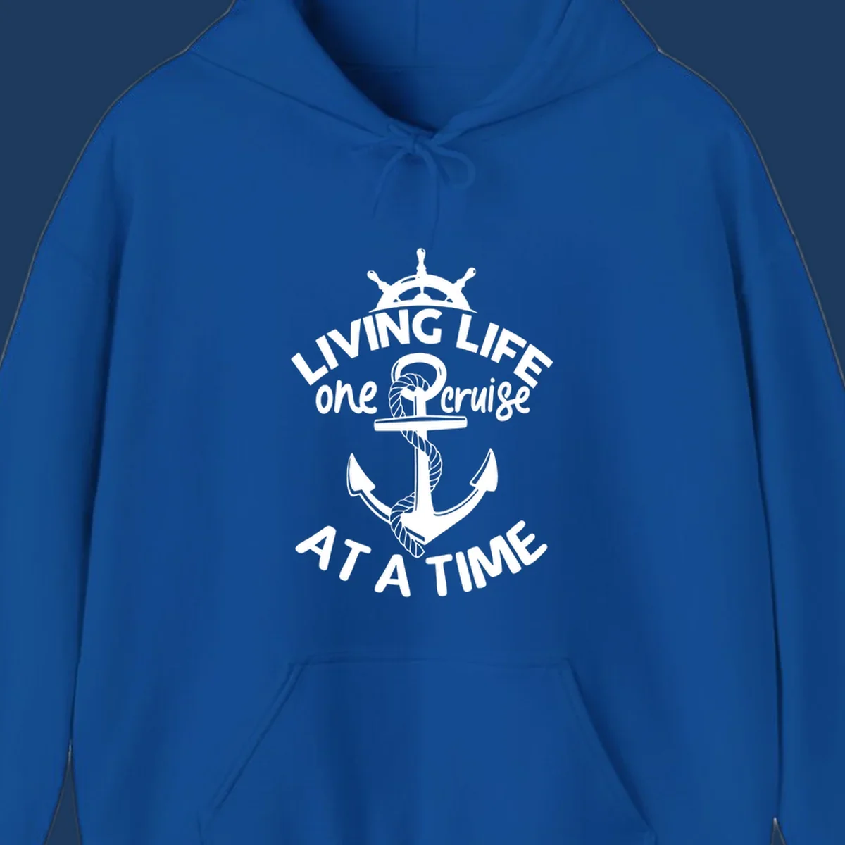 White nautical design with ship's wheel, anchor and rope on gray background with text living life one cruise at a time