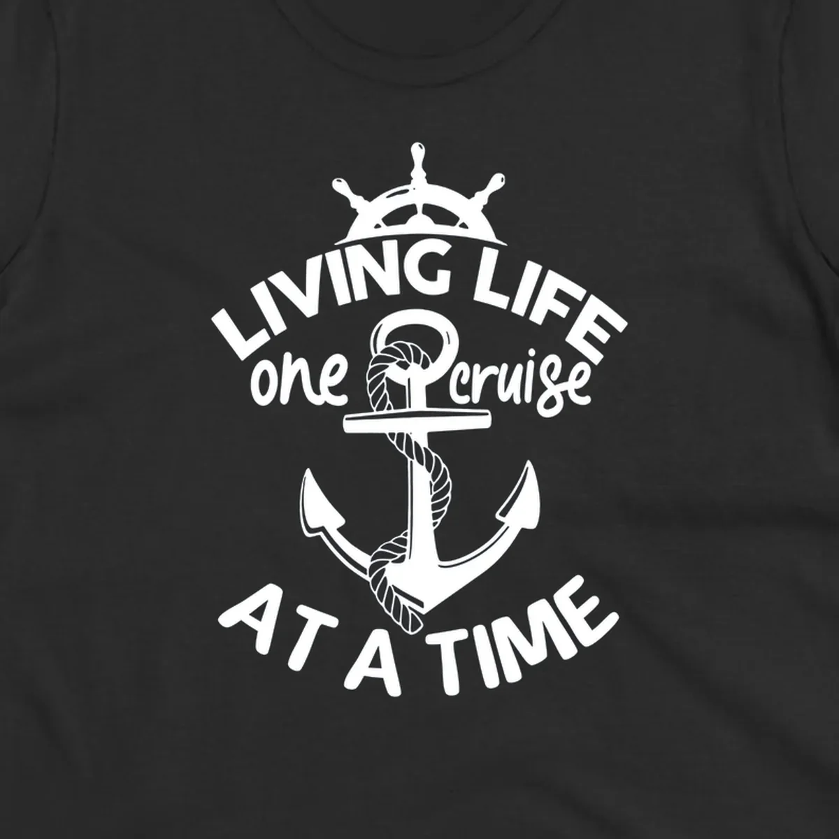 White nautical design with ship's wheel, anchor and rope on gray background with text living life one cruise at a time