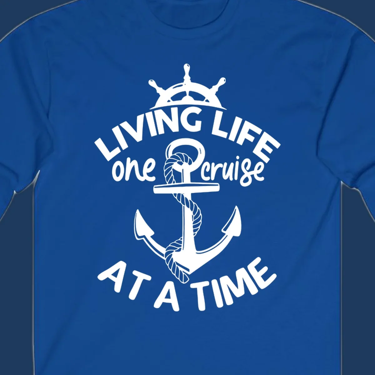 White nautical design with ship's wheel, anchor and rope on gray background with text living life one cruise at a time