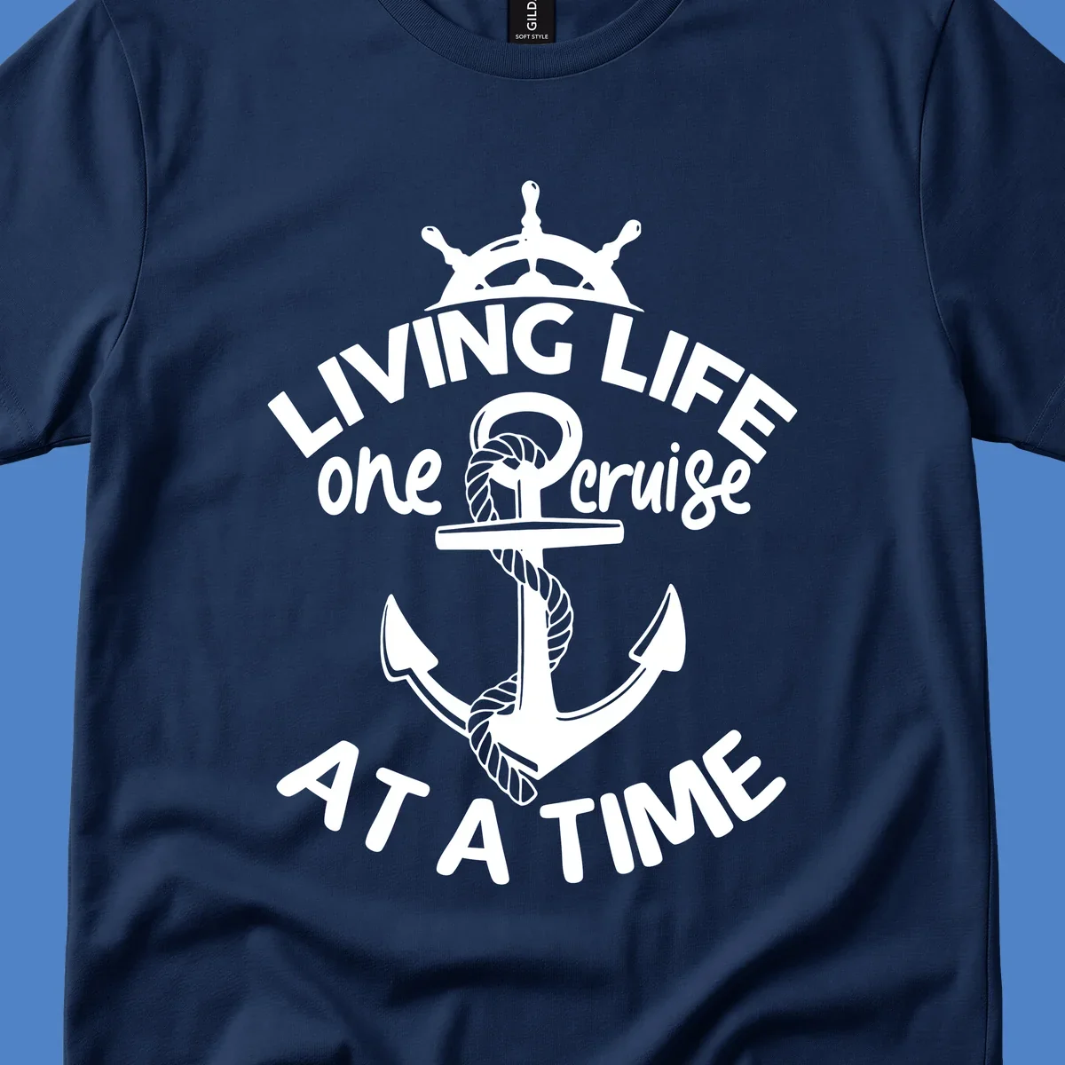 White nautical design with ship's wheel, anchor and rope on gray background with text living life one cruise at a time
