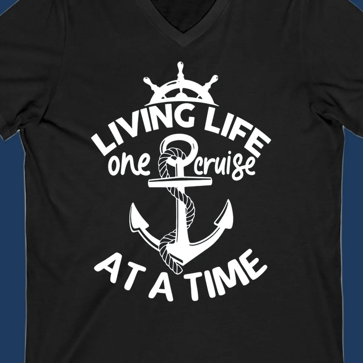 White nautical design with ship's wheel, anchor and rope on gray background with text living life one cruise at a time