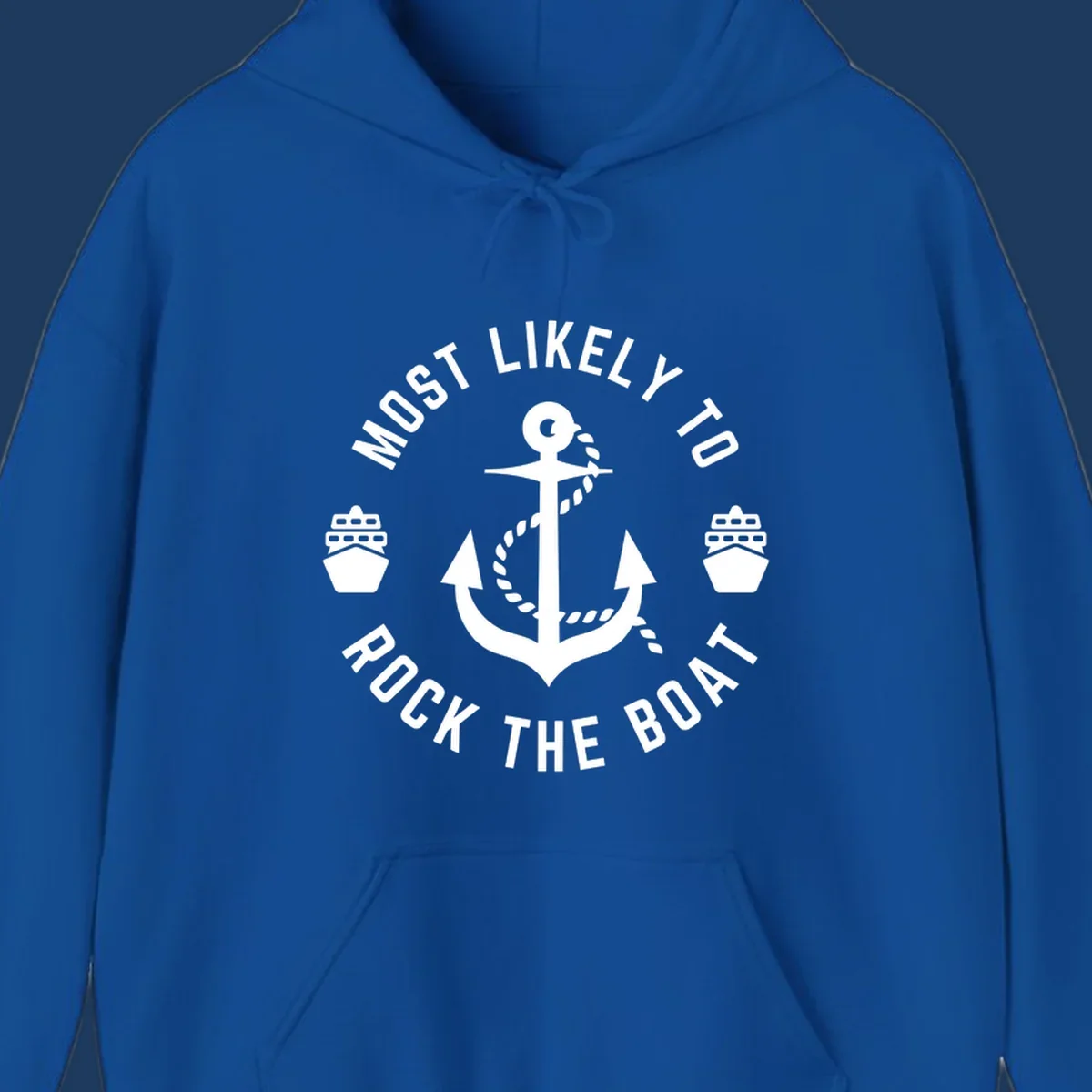 Circular badge design with anchor and rope in center, two cruise ships on sides, 'Most Likely To Rock The Boat' text in circle