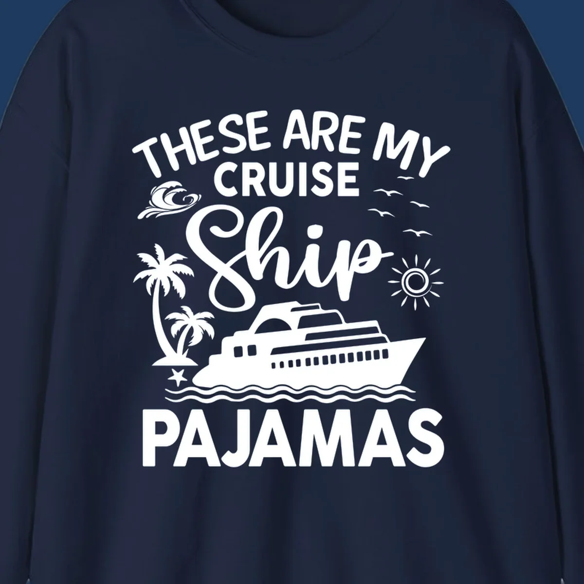 Cruise ship pajamas design with illustrated ship, palm trees, waves, sun and seagulls with text saying 'These Are My Cruise Ship Pajamas'