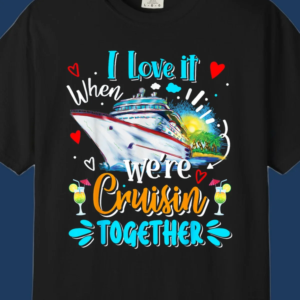 Colorful cruise ship with tropical island, hearts, and cocktails. Text reads 'I love it when we're Cruising Together' in cyan and orange lettering on gray background.