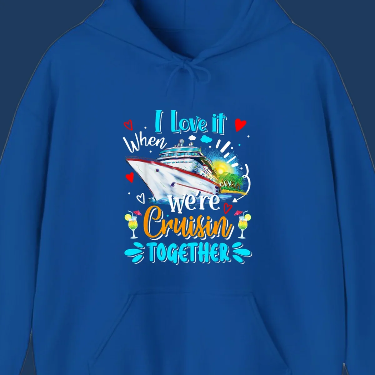 Colorful cruise ship with tropical island, hearts, and cocktails. Text reads 'I love it when we're Cruising Together' in cyan and orange lettering on gray background.