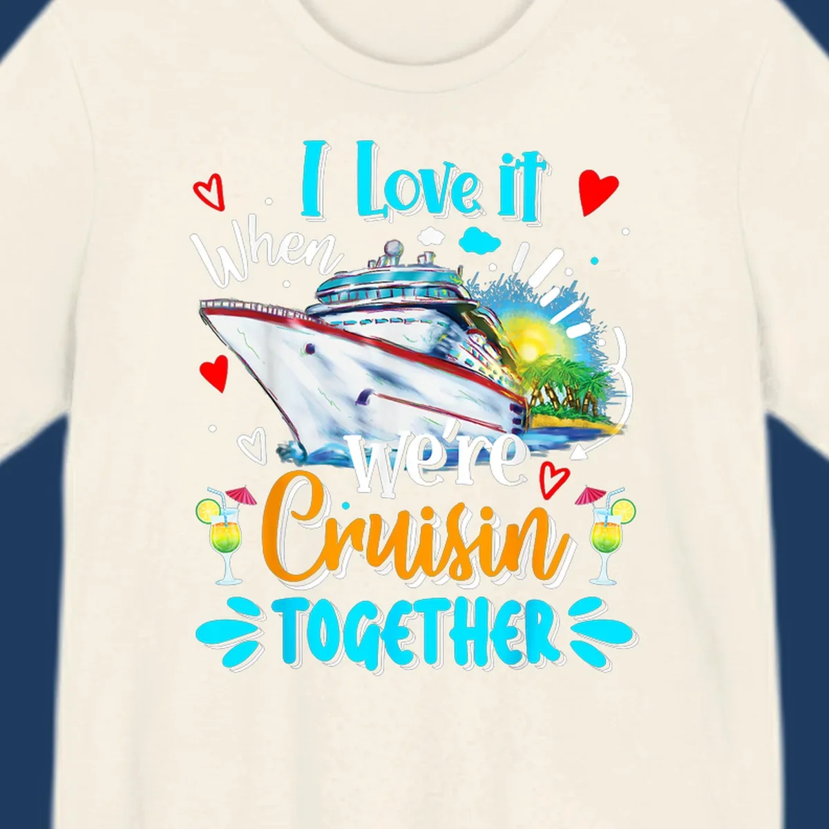 Colorful cruise ship with tropical island, hearts, and cocktails. Text reads 'I love it when we're Cruising Together' in cyan and orange lettering on gray background.