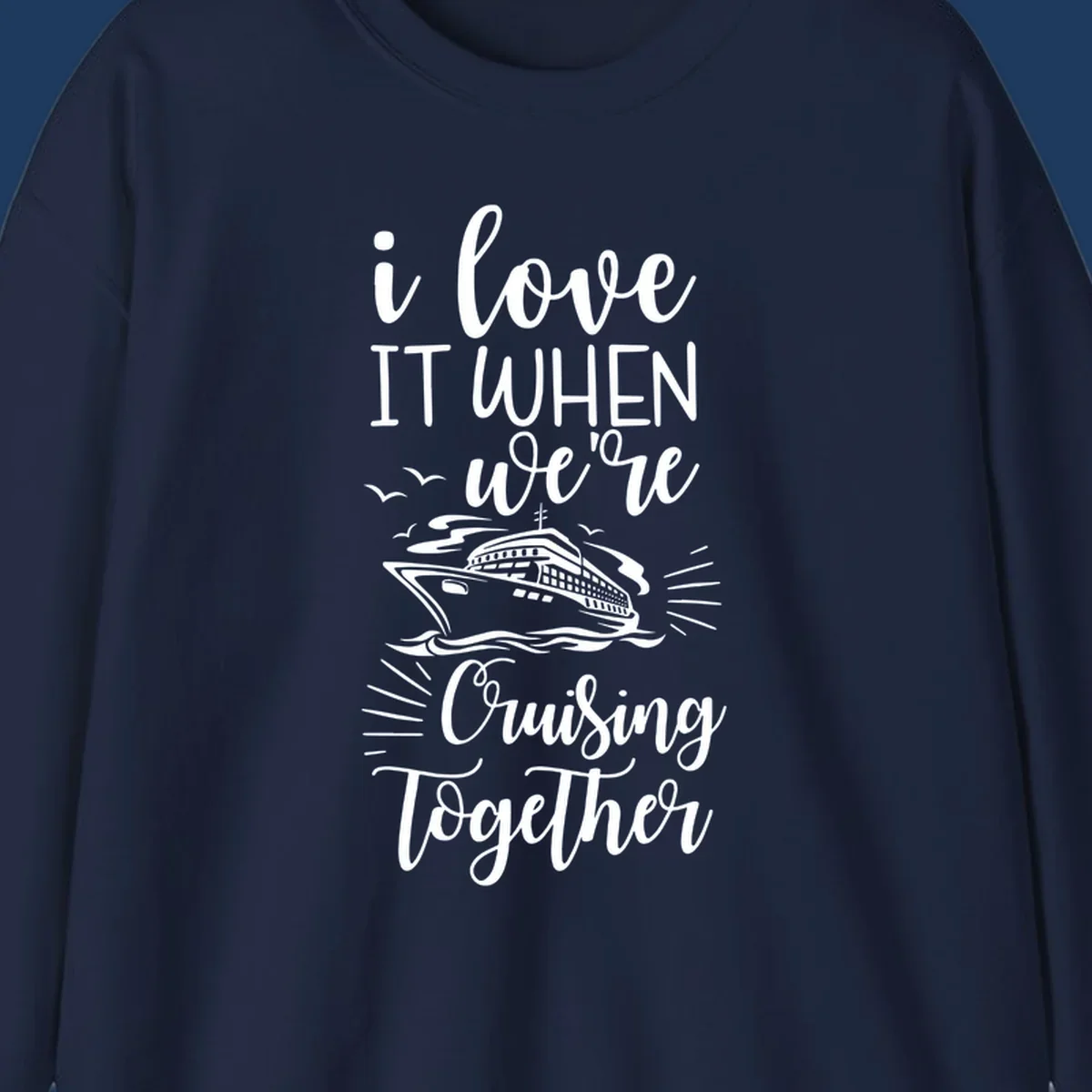 White script text reading 'i love it when we're cruising together' with an illustration of a cruise ship on ocean waves and seagulls