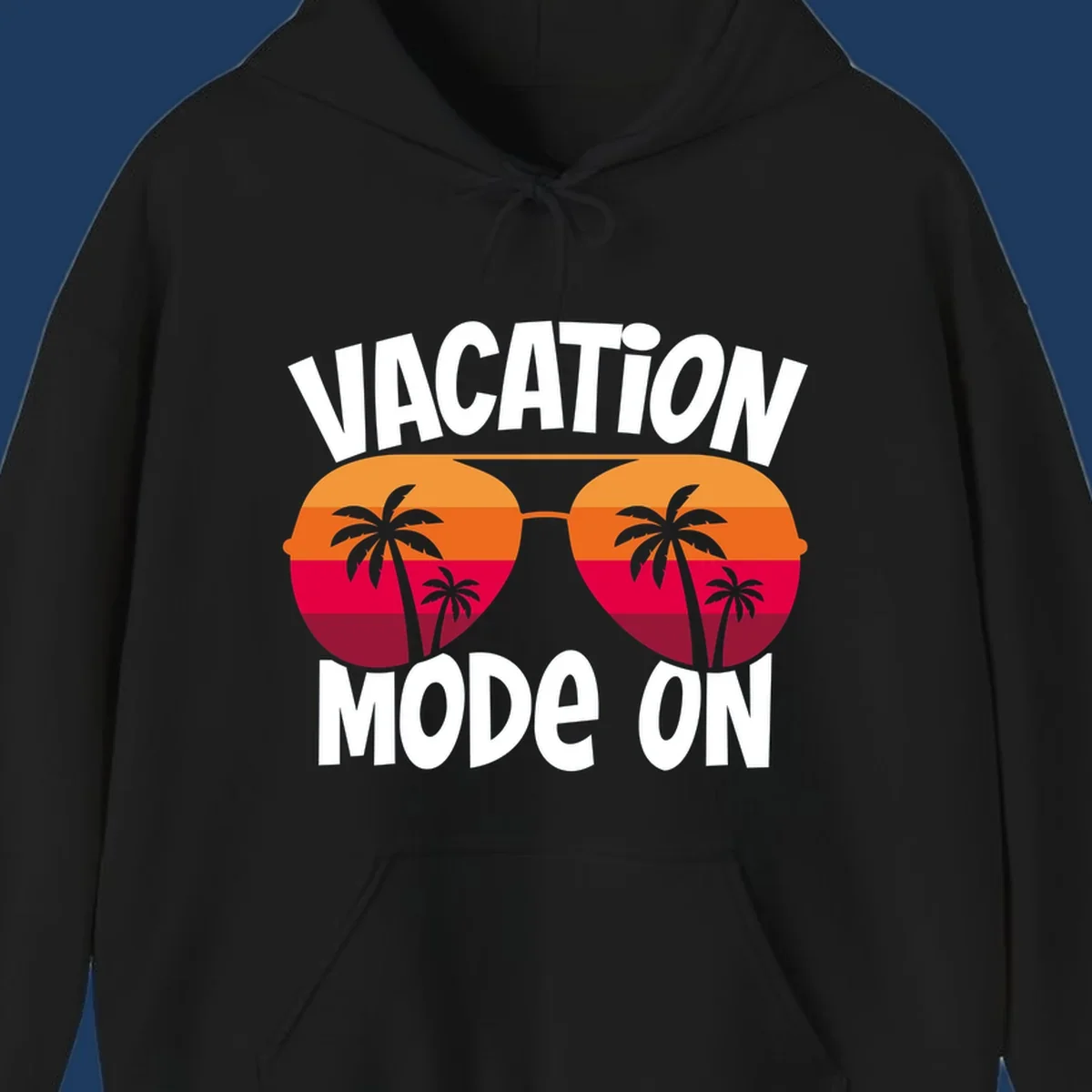 Vacation mode on design featuring oversized sunglasses with tropical sunset and palm trees inside each lens, framed by bold white text
